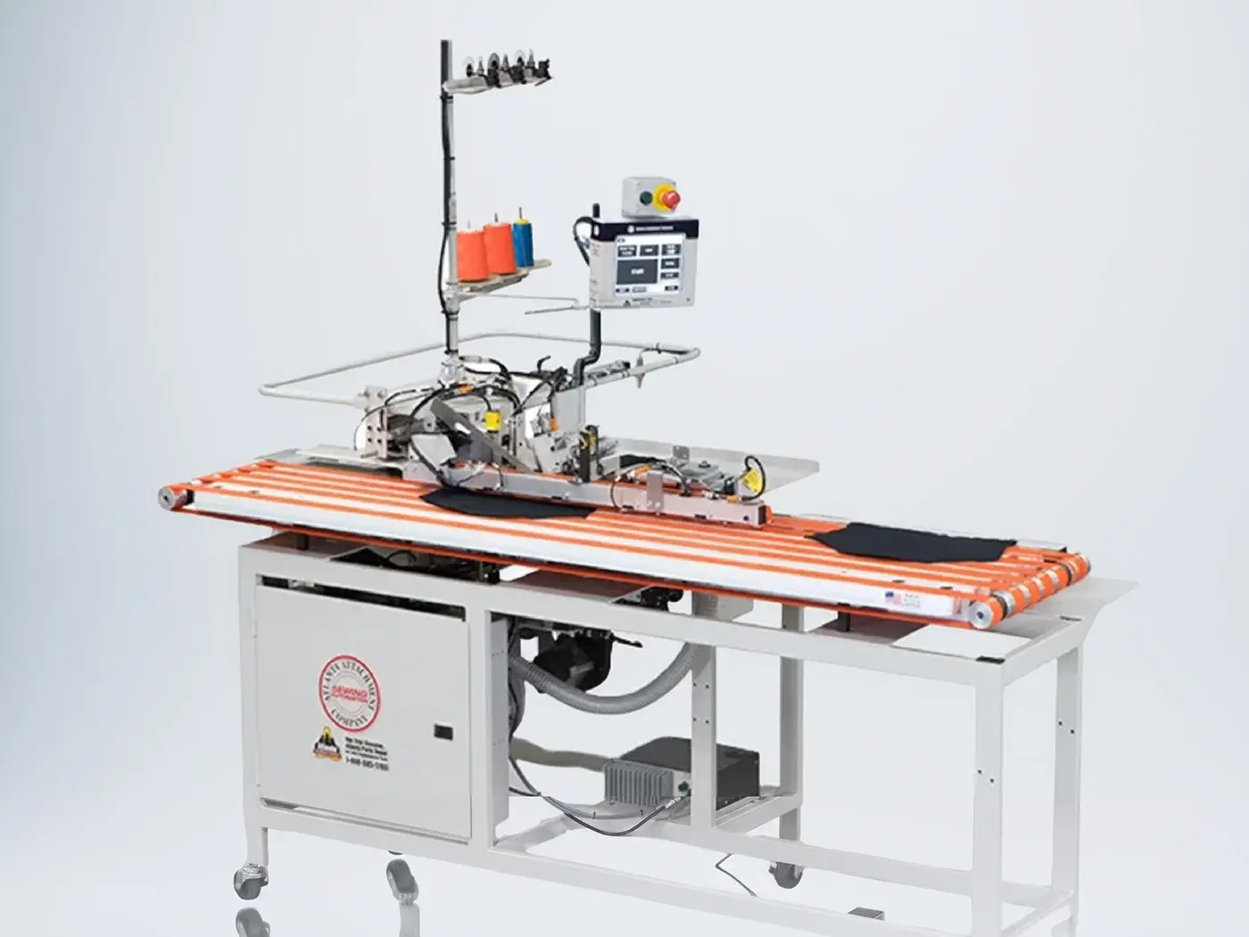Atlanta Attachment automatic sewing unit on a conveyor table with a control panel